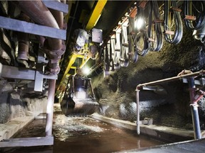 A bucket pulls solid uranium ore from a pool of "slurry" created by the jet boring machine in Cameco's Cigar Lake mine.