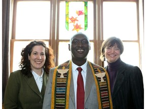 Burundian Rev. Fulgence Ndagijimana, with Saskatoon hosts Liz James (left) and Rev. Karen Fraser Gitlitz, has been imprisoned and his church riddled with bullets.