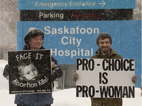 People on opposite sides to the abortion debate demonstrate in front of City Hospital in February 2013.