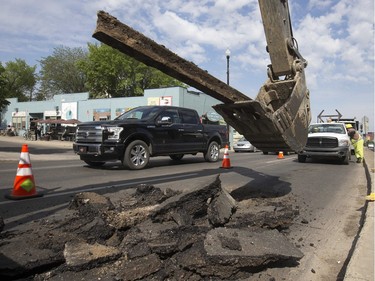 City crews had southbound Broadway Avenue Traffic down to one lane at the top of the bridge to remove an old trolley rail that had surfaced, June 11, 2015.