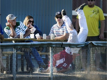 Mathieu Roy of Team Canada took a dive for the ball along the outfield fence but ended up almost crashing into some fans while after a foul ball against Guatemala in the 14th Men's World Softball Championship in Saskatoon, June 26, 2015.
