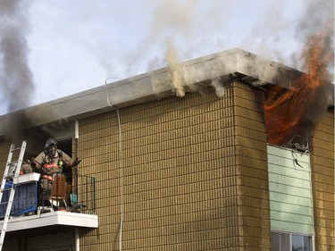 SASKATOON,SK--MARCH 04/2015--news greg year in review3- Firefighters battle a blaze which ravaged a third floor apartment at 1113 Northumberland Avenue, Thursday, June 04, 2015. (GREG PENDER/STAR PHOENIX)