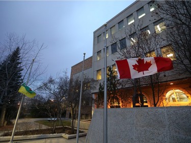 Flags fly at half mast at Saskatoon City Hall, November 16, 2015 in the wake of the Paris terror incident.