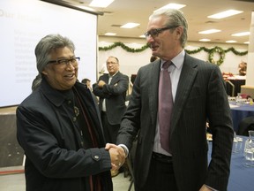 Stephen Kakfwi, former Premier, Northwest Territories, left, speaks with Stephen Shea of Ernst and Young, while attending the Wicihitowin "Working Together" Conference focusing on Aboriginal engagement, Tuesday, November 17, 2015 at TCU Place.