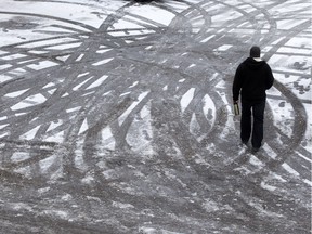 File photo - The combination of freezing rain under a layer of snow left roads, sidewalks and parking lots extremely slippery on November 18, 2015. (GREG PENDER/ SASKATOON STARPHOENIX)