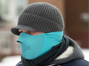 Michael Brasnus, who is from Paris, France, was covered up for the Saskatoon weather while walking down Clarence Avenue, November 18, 2015.