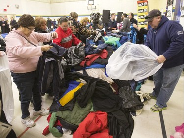 Hundreds of coats and warm winter accessories were collected through the Rock 102 Coats for Kids Campaign this year and were on display during a news conference at St. Michael school, November 19, 2015. Representatives from inner-city and community schools were given the chance to fill bags for their schools.