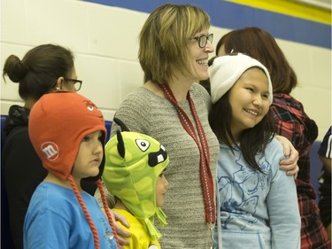 Students from St. Michael School were all smiles during the annual Coats for Kids news conference at the school, November 19, 2015. Hundreds of coats and warm winter accessories were collected through the Rock 102 Coats for Kids Campaign this year.