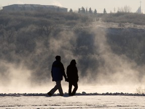 SASKATOON,SK--NOVEMBER 26/2015  1127 news spec weather -   Vapours rise from a freezing South saskatchewan River as people enjoy a walk on the Meewasin Trail, Thursday, November 26, 2015. (GREG PENDER/ SASKATOON STARPHOENIX)