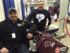 Richard Ghel (seated) and Mike Stratychuk are eager to see some snow so they can ride their vintage snowmobiles. Jason Warick/ Saskatoon StarPhoenix