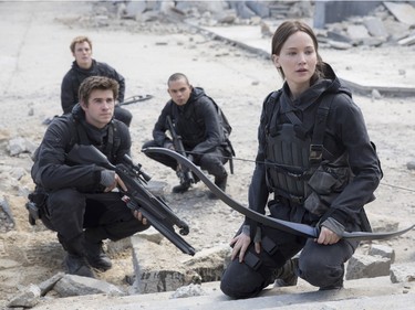 L-R: Liam Hemsworth as Gale Hawthorne, Sam Claflin as Finnick Odair, Evan Ross as Messalla and Jennifer Lawrence as Katniss Everdeen in "The Hunger Games: Mockingjay - Part 2." (Murray Close/Lionsgate via AP)