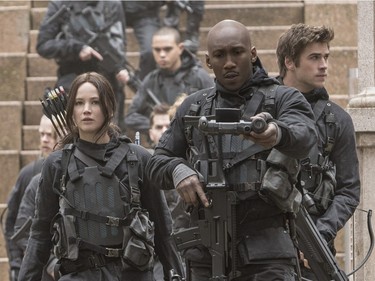 L-R: Jennifer Lawrence as Katniss Everdeen, Mahershala Ali as Boggs and Liam Hemsworth Gale Hawthorne in "The Hunger Games: Mockingjay - Part 2."