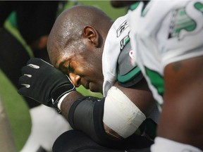 Saskatchewan Roughriders' Trevis Smith wipes his forehead after the team lost to the Winnipeg Blue Bombers in September 2004.