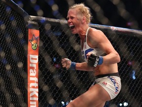 Holly Holm celebrates an upset victory over Ronda Rousey in their UFC 193 women's bantamweight championship bout at Etihad Stadium on Nov. 15, 2015 in Melbourne, Australia.