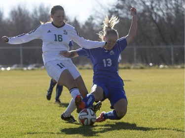 University of Saskatchewan Huskies' Leesa Eggum battles for the ball against University of Lethbridge Pronghorns' Kim Shellenberg in CIS Women's Soccer playoff action, October 31, 2015.