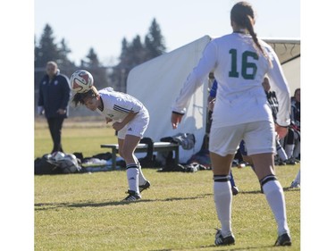 University of Saskatchewan Huskies' Julianne Labach (L) heads the ball against the University of Lethbridge Pronghorns in CIS Women's Soccer playoff action, October 31, 2015.
