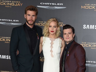 L-R: Actors Liam Hemsworth, Jennifer Lawrence and Josh Hutcherson arrive for the premiere of Lionsgate's "The Hunger Games: Mockingjay - Part 2" at Microsoft Theatre in Los Angeles, California, November 16, 2015.