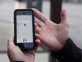 WINDSOR, ONTARIO - NOVEMBER 12, 2015 - Windsor Star reporter Craig Pearson books a ride from Uber X on November 12, 2015 in Windsor, Ontario.   Uber started business in the region at 3:00 pm Thursday. (JASON KRYK/WINDSOR STAR)