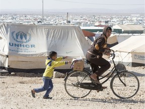 Young Syrian refugees play in the Zaatari Refugee Camp in Jordan.