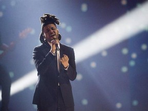 The Weeknd performs during the 2015 Juno Awards, in Hamilton, Ont., on March 15, 2015. The Toronto native, born Abel Tesfaye, has been nominated for seven Grammys, including Best Record of the Year and Best Album of the Year awards in the run up to the 2015 Grammys. Fellow Canucks Drake and Justin Bieber earned a Grammy nod each. THE CANADIAN PRESS/Nathan Denette