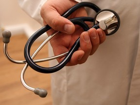 A doctor holds a stethoscope in this file photo.