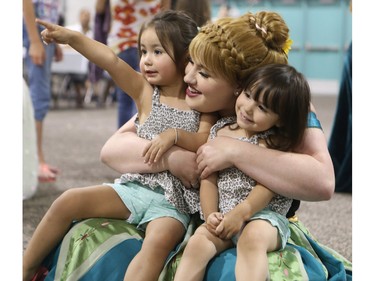 Princess Anna meets with twins Ava (L) and Olivia McKenzie of Air Ronge on July 9, 2015 in Saskatoon at an event sponsored by Cameco at Prairieland Park.