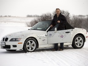 Vern Klassen, with his autographed BMW — more than 640 signatures.