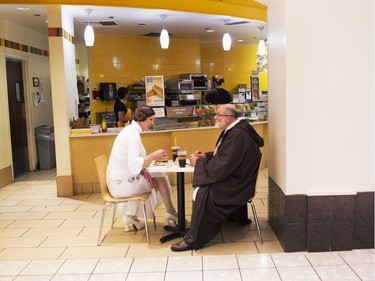 Bonta and Fred Cunningham, dressed as Princess Leia and Obi-Wan Kenobi, grab something to eat at the MacArthur Center food court in Norfolk, Va., before seeing the showing of "Star Wars: The Force Awakens" on Thursday, Dec. 17, 2015.