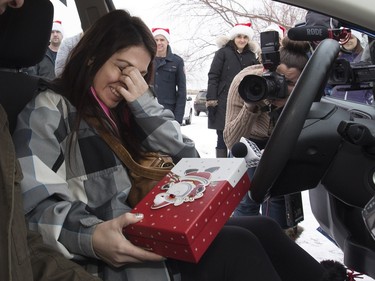 Radio station C95, the Kinsmen Club of Saskatoon and other sponsors surprised Janelle Bruneau and her sons, Tyler and Trey, with a Christmas Wish, December 14, 2015.  They were surprised with toys, groceries, gifts and even a car — courtesy of Precision Auto Body. Bruneau was emotional during the presentation.