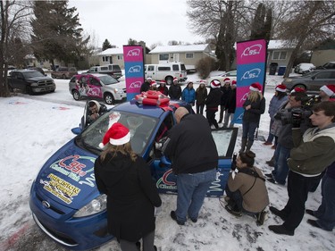 Radio station C95, the Kinsmen Club of Saskatoon and other sponsors surprised Janelle Bruneau and her sons, Tyler and Trey, with a Christmas Wish, December 14, 2015.  They were surprised with toys, groceries, gifts and even a car — courtesy of Precision Auto Body.