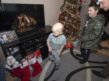 Radio station C95, the Kinsmen Club of Saskatoon and other sponsors surprised Janelle Bruneau and her sons, Tyler and Trey, with a Christmas Wish, December 14, 2015.  They were surprised with toys, groceries, gifts and even a car — courtesy of Precision Auto Body. Here the boys see a new TV and stockings.