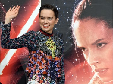 Actor Daisy Ridley waves as she appears at a press conference to promote "Star Wars: The Force Awakens" in Urayasu, Tokyo, Japan, December 11, 2015.