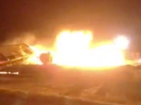 Video shot on Oct. 7, 2014 by Brian Weber, the Wadena volunteer fire department deputy chief, shows a massive fireball that caught cleanup crews by surprise as they worked at the site of a train derailment in Saskatchewan