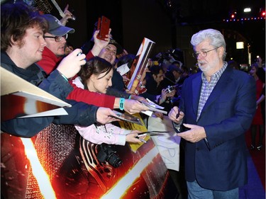George Lucas signs autographs for fans at the European premiere of "Star Wars: The Force Awakens" in London, England, December 16, 2015.