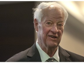 Hockey legend Gordie Howe leaves his hotel on his way tribute to him in Saskatoon, Friday, February 6, 2015.