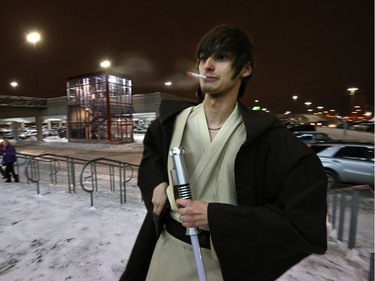Jedi Tom Glendinning steps out for a smoke break as he awaits the first screening of Star Wars: The Force Awakens at SilverCity Polo Park in Winnipeg on Thursday, Dec. 17, 2015.