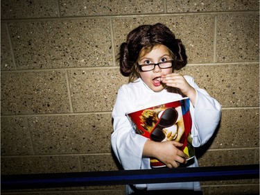 Julianna Backoski, 7, of Linden,  dressed as Princess Leia poses for a portrait during the opening night of Star Wars: The Force Awakens, Thursday, Dec. 17, 2015, at NCG Trillium Cinema in Grand Blanc, Mich.