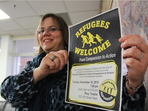 Lori Steward, of the Global Gathering Place, can be seen holding a refugees welcome sign at the Global Gathering Place offices in early November. She said she's excited about welcoming Syrian refugees to the province in the coming days as 14 refugees bound for Saskatoon will be touching down in Toronto on Dec. 18, 2015.