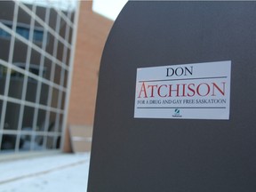 Mysterious stickers using Mayor Don Atchison's name and the City of Saskatoon logo that appeared in downtown Saskatoon in mid-December are now being removed by bylaw inspectors in the city.