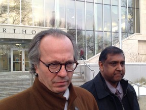 Nowshad Ali, right, and his lawyer Ron Piche speak with media outside Saskatoon Court of Queen's Bench on Friday, Dec. 18, 2015, following Ali's acquittal on a sexual assault charge.