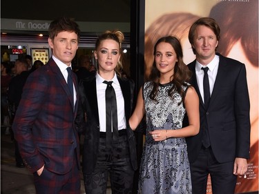 L-R: Actors Eddie Redmayne, Amber Heard and Alicia Vikander and director Tom Hooper attend the premiere of Focus Features' "The Danish Girl" at Westwood Village Theatre on November 21, 2015 in Westwood, California.