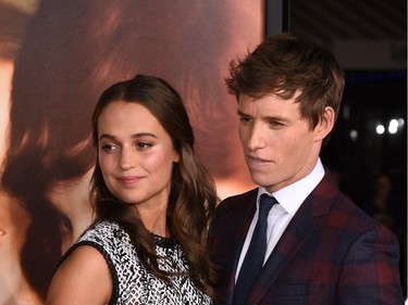 Actors Alicia Vikander and Eddie Redmayne attend the premiere of Focus Features' "The Danish Girl" at Westwood Village Theatre on November 21, 2015 in Westwood, California.