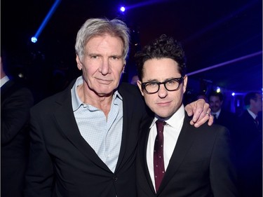 Actor Harrison Ford (L) and director J.J. Abrams attend the after party for the World Premiere of "Star Wars: The Force Awakens" on Hollywood Blvd on December 14, 2015 in Hollywood, California.