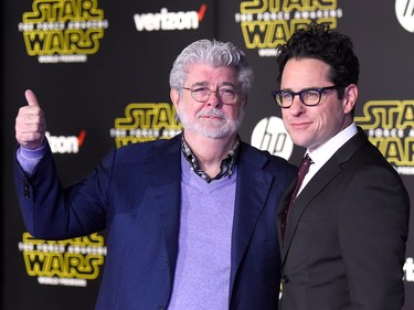 Filmmaker George Lucas (L) and writer-director J.J. Abrams attend the premiere of Walt Disney Pictures and Lucasfilm's "Star Wars: The Force Awakens" on December 14, 2015 in Hollywood, California.