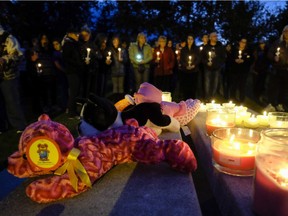 Residents gather for a candlelight vigil for Hailey Dunbar-Blanchette in Blairmore, Alta., Sept. 15, 2015.