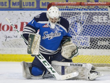 Saskatoon Blades goalie Evan Smith makes a save against the Kelowna Rockets during first period WHL action, December 19, 2015.