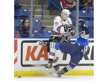Kelowna Rockets forward Cole Linaker collides with Saskatoon Blades forward Mason McCarty during first period WHL action, December 19, 2015.