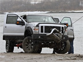 Saskatoon Fire and Protective Services recover an abandoned and unoccupied stolen truck in the river at the Clarkboro Ferry, on April 25, 2014.