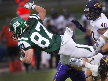 University of Saskatchewan Huskies #87 Mitch Hillis was sent flying after a first quarter catch at midfield in a CIS exhibition game against Wilford Laurier Golden Hawks at Griffith Stadium in Saskatoon, August 21, 2015.