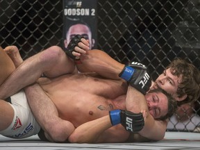 Olivier Aubin-Mercier, right, controls Tony Sims on the matt during a lightweight bout at UFC fight night at SaskTel Centre on Sunday, Aug. 23, 2015.